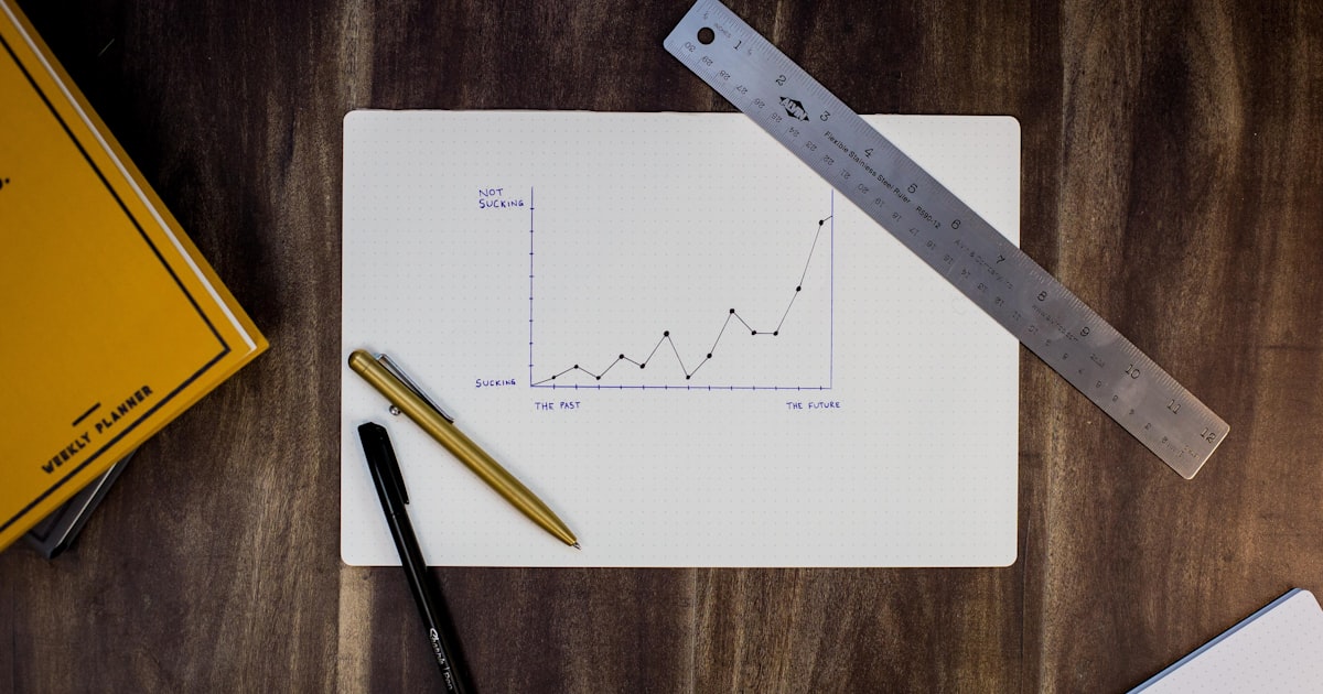 Accountant working with financial ledgers and spreadsheets