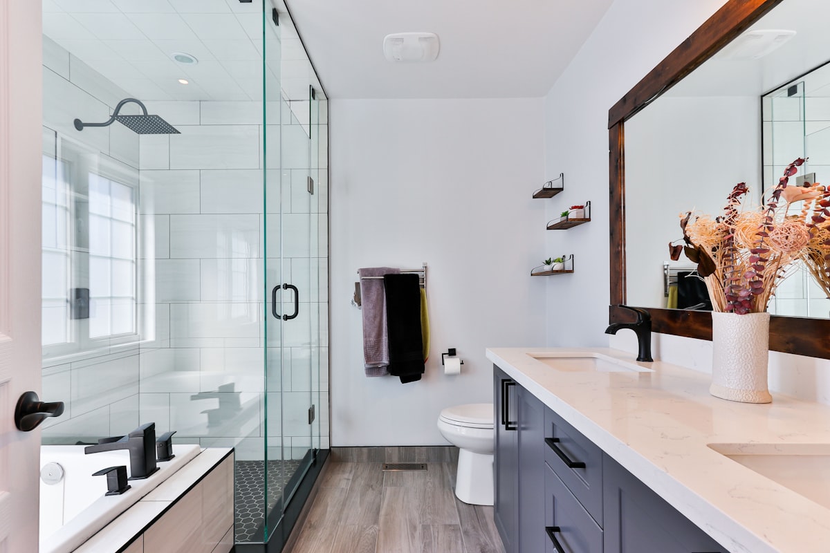 Modern remodeled bathroom with glass shower and custom vanity