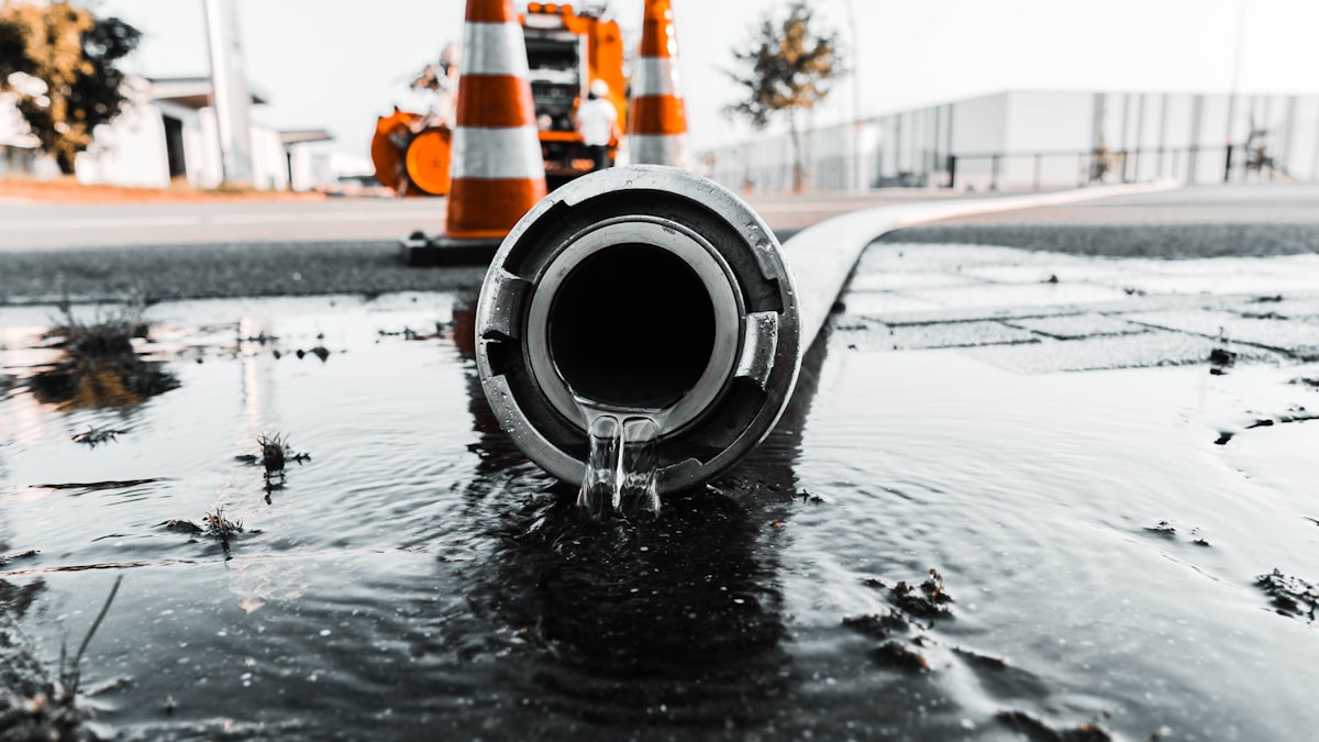 Water leaking from a pipe fitting at an emergency repair site
