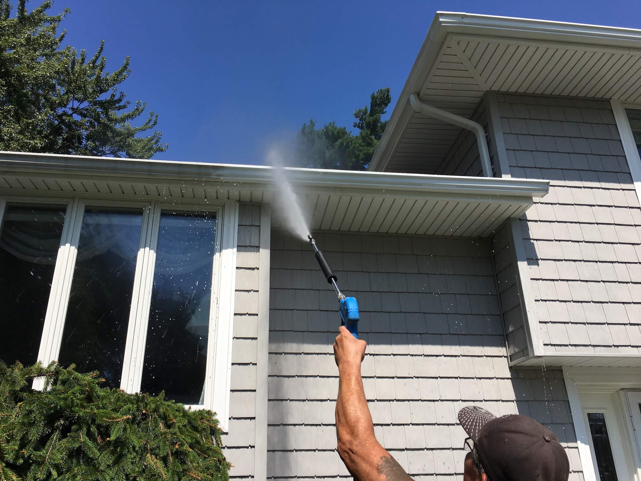 Soft washing a delicate roof or siding surface