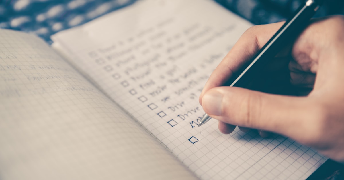 Person reviewing insurance documents at a desk
