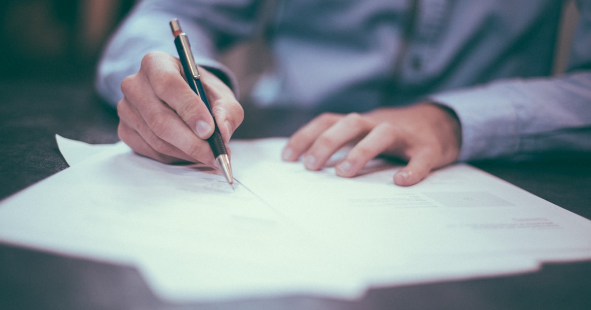 Insurance professional reviewing documents with a client