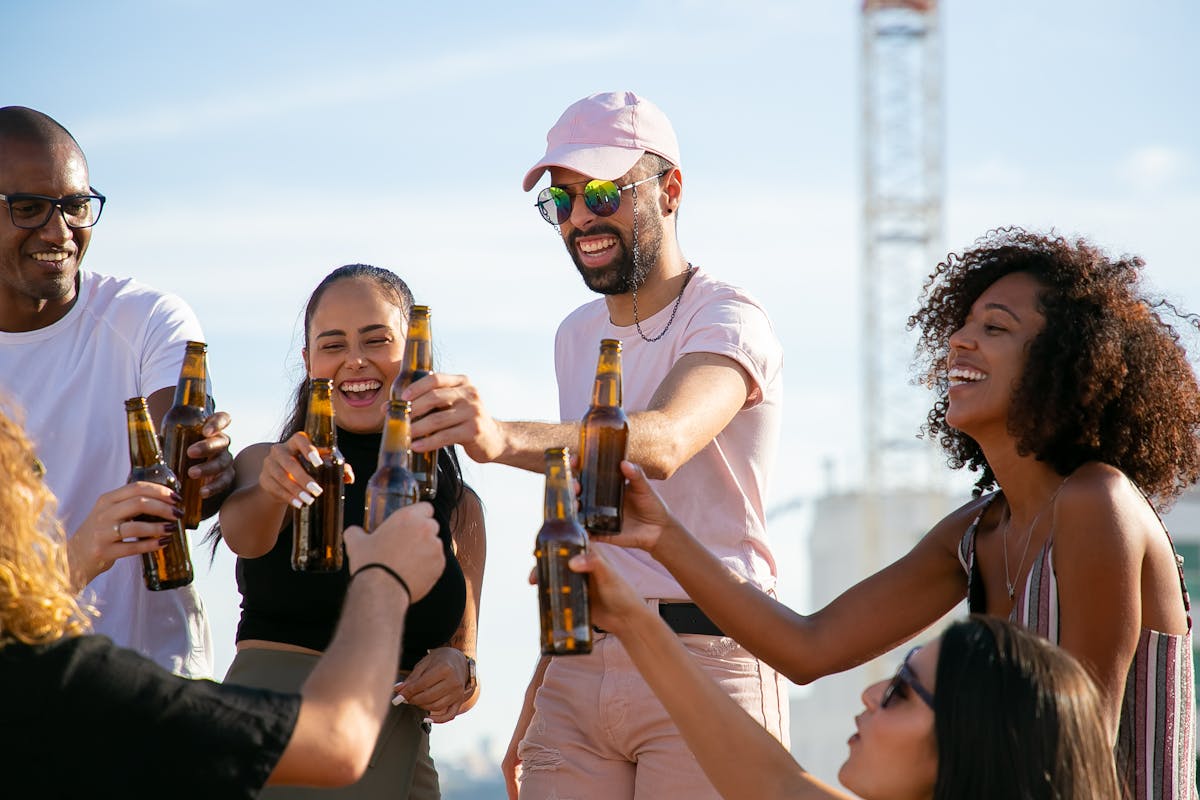 Stock photo of attractive people toasting beers, unlike actual Beer Run participants