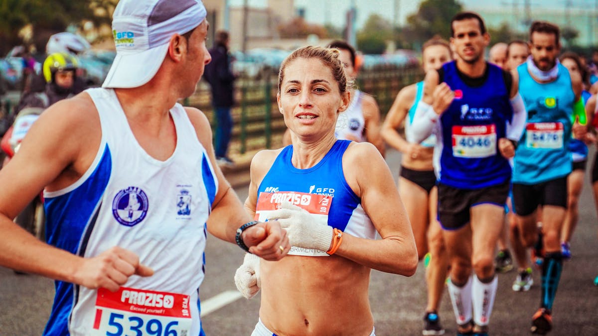 Stock photo of people running in proper athletic gear, unlike Beer Run participants