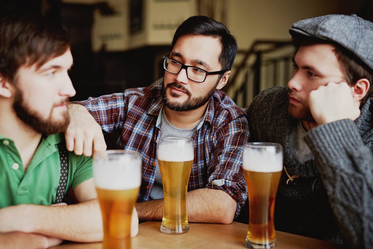 Stock photo of people socializing calmly at a bar, far more composed than Beer Run veterans