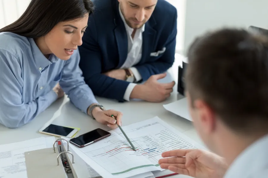 Business owners reviewing strategy in a meeting