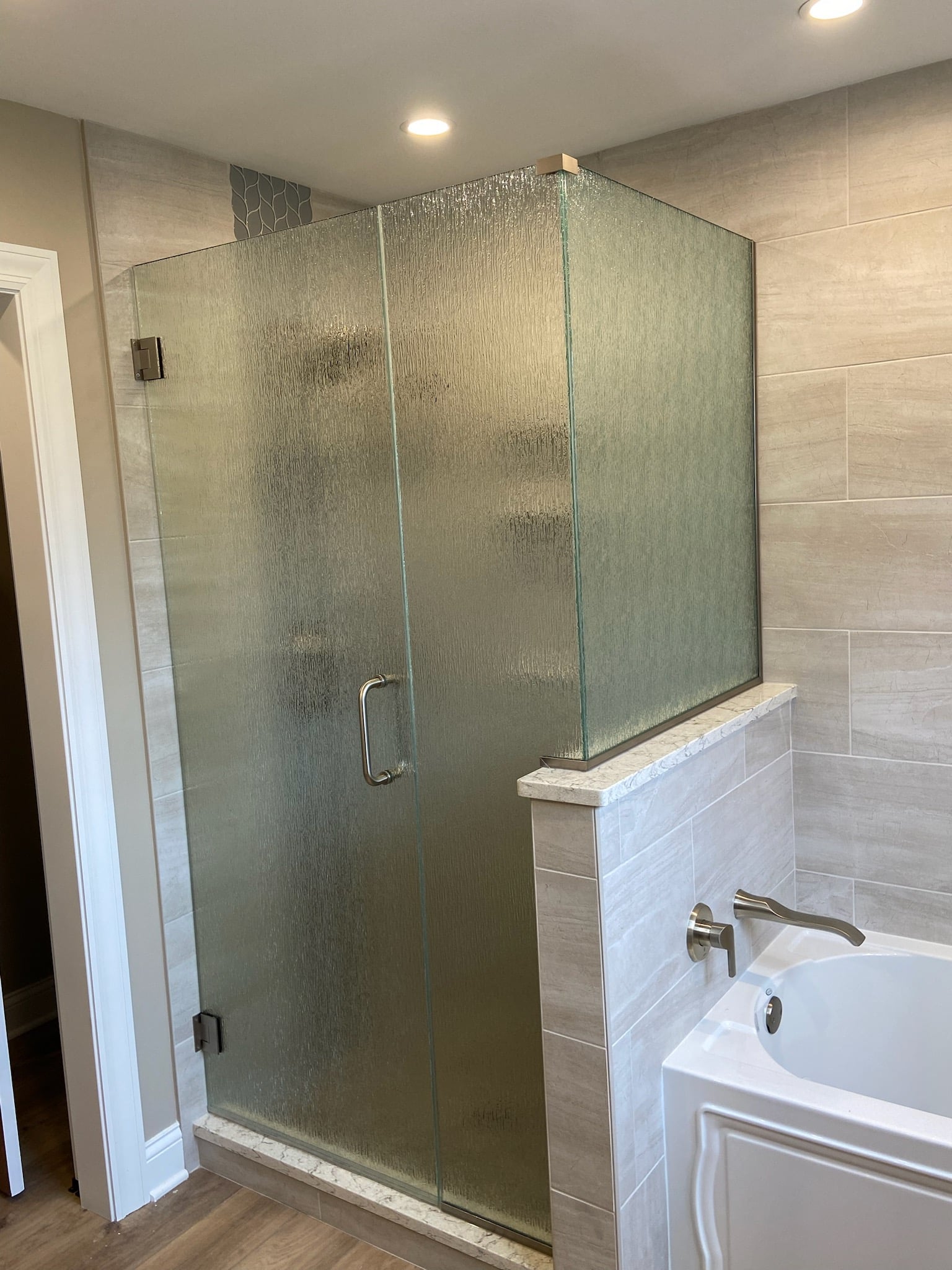 Walk-in shower with custom glass panels